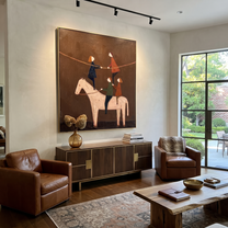 Painted Saddle Meet the Open Sky - symbolic horse and rider painting by Isabelle Laurent, modern Western vertical wall art – styled room scene view 5