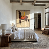 Wild Grace Meet the Open Sky - horse and rider painting by Isabelle Laurent, modern Western vertical wall art – styled room scene view 4
