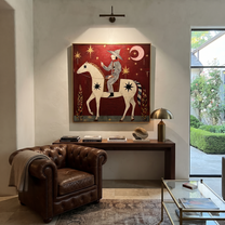 Painted Saddle Follow the Dust Road - symbolic horse and rider painting by Isabelle Laurent, modern Western square wall art – styled room scene view 4
