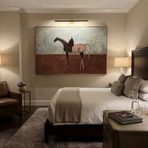 Desert Rhythm Follow the Dust Road - horse and rider painting by Isabelle Laurent, modern Western horizontal wall art – styled room scene view 2