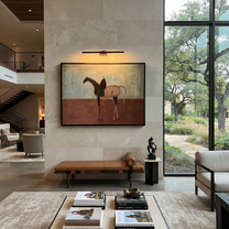 Desert Rhythm Follow the Dust Road - horse and rider painting by Isabelle Laurent, modern Western horizontal wall art – styled room scene view 3