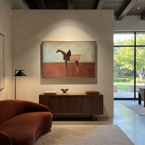 Desert Rhythm Follow the Dust Road - horse and rider painting by Isabelle Laurent, modern Western horizontal wall art – styled room scene view 5