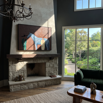 Moonlit Horse Follow the Dust Road - figure and horse painting by Isabelle Laurent, modern Western horizontal wall art – styled room scene view 2