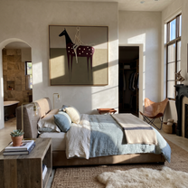 Wild Grace Share the Long Journey - symbolic horse and rider painting by Isabelle Laurent, modern Western square wall art – styled room scene view 3