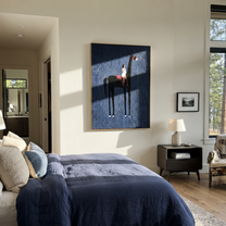 Painted Saddle Return at Dusk - symbolic horse and rider painting by Isabelle Laurent, modern Western vertical wall art – styled room scene view 5