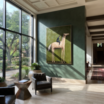 Western Stars Return at Dusk - figure and horse painting by Isabelle Laurent, modern Western vertical wall art – styled room scene view 1