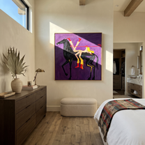 Desert Rhythm Return at Dusk - symbolic horse and rider painting by Isabelle Laurent, modern Western square wall art – styled room scene view 1