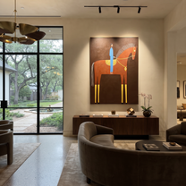 Blue Rider Meets the Red Horse - red horse rider painting by Isabelle Laurent, modern Western vertical wall art – styled room scene view 2