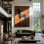 The Bent Rider Listens to the Black Horse - black horse and rider painting by Isabelle Laurent, modern Western vertical wall art – styled room scene view 1