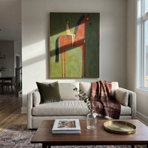 The Red Horse Carries a Quiet Rider - red horse rider painting by Isabelle Laurent, modern Western vertical wall art – styled room scene view 3
