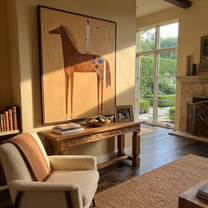 The White Figure Stands above the Brown Horse - standing horse figure painting by Isabelle Laurent, modern Western vertical wall art – styled room scene view 1
