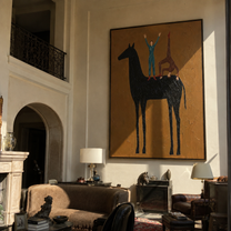 Two Blue Figures Balance on the Black Horse - equestrian balance painting by Isabelle Laurent, modern Western vertical wall art – styled room scene view 3