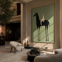 The Pale Rider Holds the Black Horse Still - black horse rider painting by Isabelle Laurent, modern Western vertical wall art – styled room scene view 1