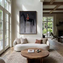 Red Saddle Meets Charcoal - black horse rider painting by Isabelle Laurent, modern Western vertical wall art – styled room scene view 2