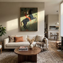 Feather Rider Rears Green - rearing black horse painting by Isabelle Laurent, modern Western vertical wall art – styled room scene view 1