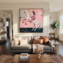 Spotted Horse Rises Blush - rearing horse rider painting by Isabelle Laurent, modern Western square wall art – styled room scene view 1