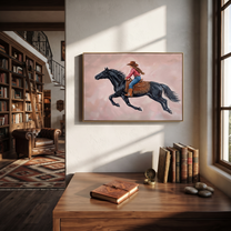 Cowgirl Gallops Through Blush - black horse cowgirl painting by Isabelle Laurent, modern Western horizontal wall art – styled room scene view 2