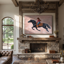 Cowgirl Gallops Through Blush - black horse cowgirl painting by Isabelle Laurent, modern Western horizontal wall art – styled room scene view 5
