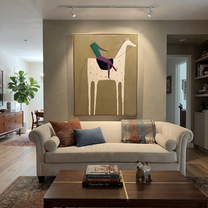 White Horse Carries Green - spotted white horse rider painting by Isabelle Laurent, modern Western vertical wall art – styled room scene view 3