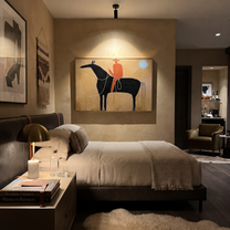 Blue Star Pulls Rein - black horse rider painting by Isabelle Laurent, modern Western horizontal wall art – styled room scene view 3