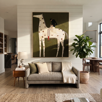 Brown Spots Carry Black - spotted white horse rider painting by Isabelle Laurent, modern Western vertical wall art – styled room scene view 2
