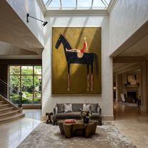 Red Dress Rests High - black horse woman painting by Isabelle Laurent, modern Western vertical wall art – styled room scene view 5