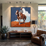 Clouds Gather Behind Saddle - paint horse cowboy painting by Isabelle Laurent, modern Western square wall art – styled room scene view 1