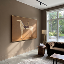 Pale Dapples Cross Ochre - spotted horse rider painting by Isabelle Laurent, modern Western horizontal wall art – styled room scene view 3