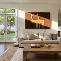 Golden Horses Share Breath - two gold horse painting by Isabelle Laurent, modern Western horizontal wall art – styled room scene view 1