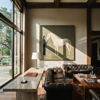 White Horse Greets Midnight - woman and white horse painting by Isabelle Laurent, modern Western square wall art – styled room scene view 2