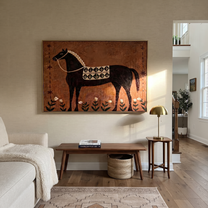 Flowers Rise Beneath Dapples - decorative black horse painting by Isabelle Laurent, modern Western horizontal wall art – styled room scene view 4
