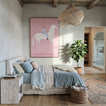 Pink Air Carries Ivory - white horse rider painting by Isabelle Laurent, modern Western vertical wall art – styled room scene view 5