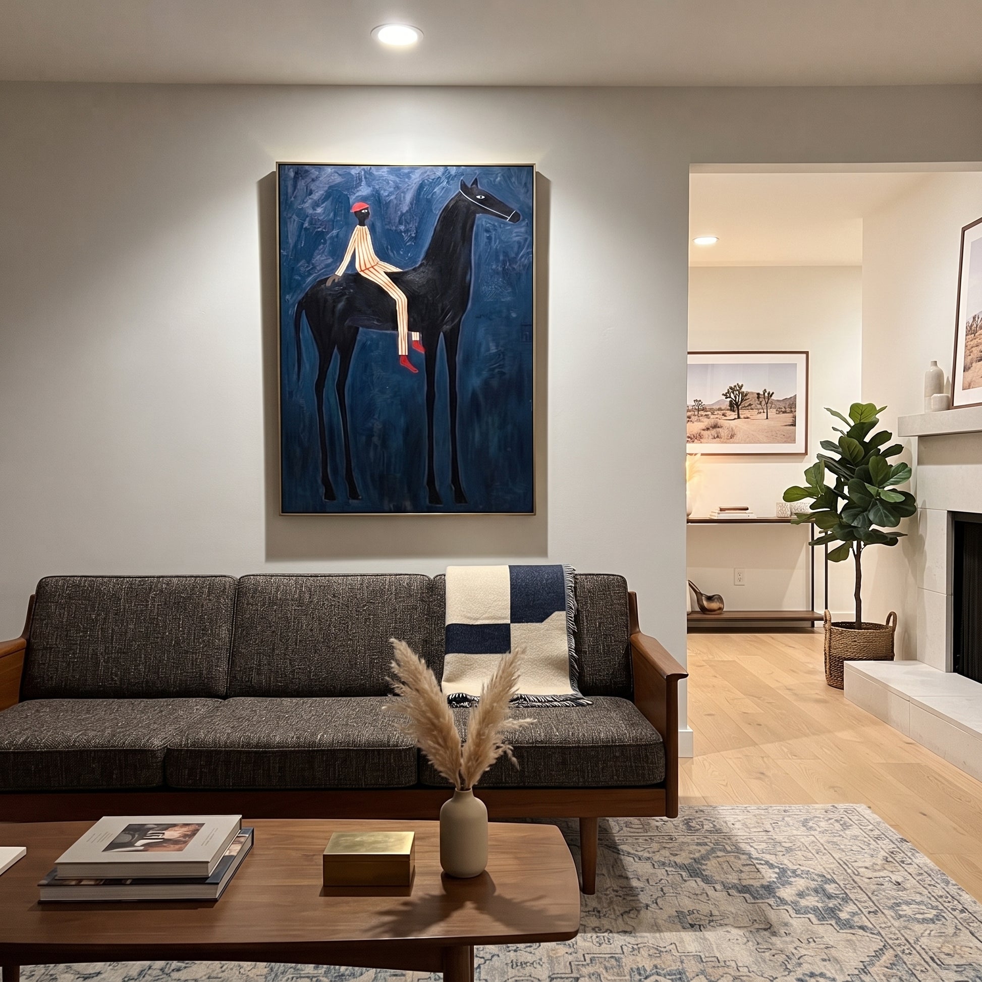 Red Hat Crosses Cobalt - black horse rider painting by Isabelle Laurent, modern Western vertical wall art – styled room scene view 5