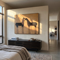 Two Shadows Meet Warmth - black horse pair painting by Isabelle Laurent, modern Western horizontal wall art – styled room scene view 4