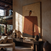 Rust Shoulders Hold Ground - monumental rust jacket figure by Marcus Lau, Retro Modern vertical wall art – styled room scene view 1