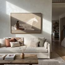Reins Curve Through Taupe - woman and white horse painting by Hannah Brooks, minimalist figurative horizontal wall art – styled room scene view 3