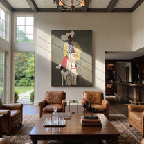 Four Hounds Follow Crimson - cowboy and four hounds painting by Hannah Brooks, minimalist figurative vertical wall art – styled room scene view 3
