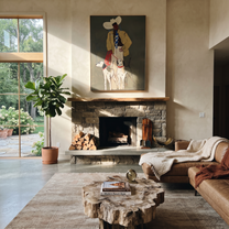 Four Hounds Follow Crimson - cowboy and four hounds painting by Hannah Brooks, minimalist figurative vertical wall art – styled room scene view 4