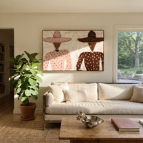 Pink Dots Meet Brown - polka dot figure pair painting by Elliot Vale, modern figurative horizontal wall art – styled room scene view 1