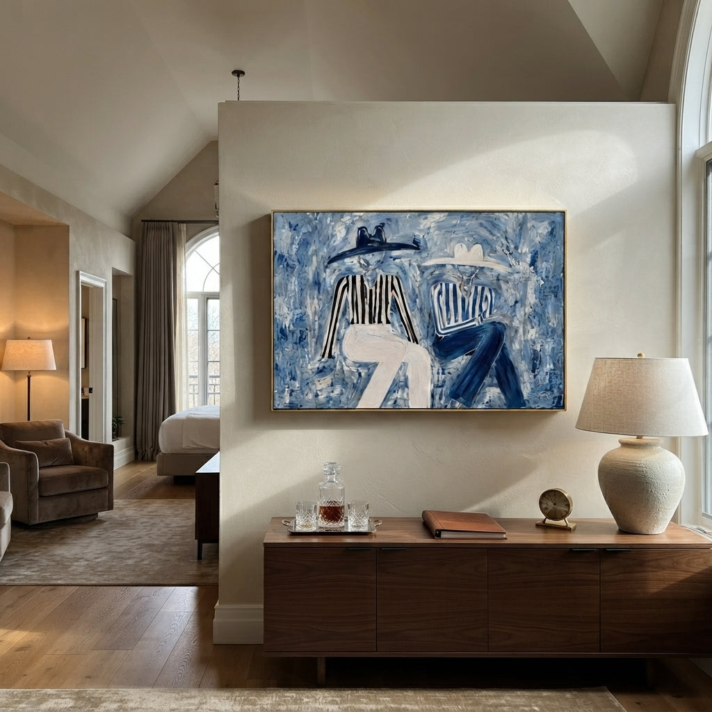 Blue Coats Cross Stillness - seated blue figure pair painting by Elliot Vale, modern figurative horizontal wall art - styled room scene view 2