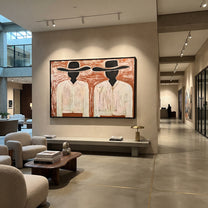 Black Faces Hold White - black face figure pair painting by Elliot Vale, modern figurative horizontal wall art - styled room scene view 4