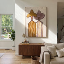 Ochre Hat Meets Mauve - pastel striped figure pair painting by Elliot Vale, modern figurative vertical wall art - styled room scene view 1