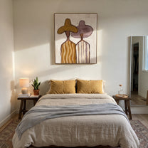 Ochre Hat Meets Mauve - pastel striped figure pair painting by Elliot Vale, modern figurative vertical wall art - styled room scene view 5