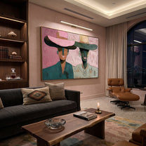 Pink Brims Frame Smiles - smiling hat figure pair painting by Elliot Vale, modern figurative horizontal wall art - styled room scene view 5