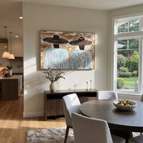 Brown Hats Cross Currents - wide hat figure pair painting by Elliot Vale, modern figurative horizontal wall art - styled room scene view 3