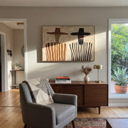 Brown Brims Guard Stripes - bearded striped figure pair painting by Elliot Vale, modern figurative horizontal wall art - styled room scene view 1