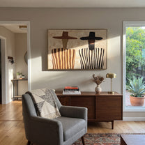 Brown Brims Guard Stripes - bearded striped figure pair painting by Elliot Vale, modern figurative horizontal wall art - styled room scene view 1