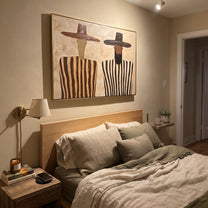 Brown Brims Guard Stripes - bearded striped figure pair painting by Elliot Vale, modern figurative horizontal wall art - styled room scene view 4