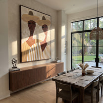 White Hats Frame Faces - long neck figure pair painting by Elliot Vale, modern figurative vertical wall art - styled room scene view 3