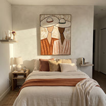 White Hats Lean Together - pastel hat figure pair painting by Elliot Vale, modern figurative vertical wall art - styled room scene view 2